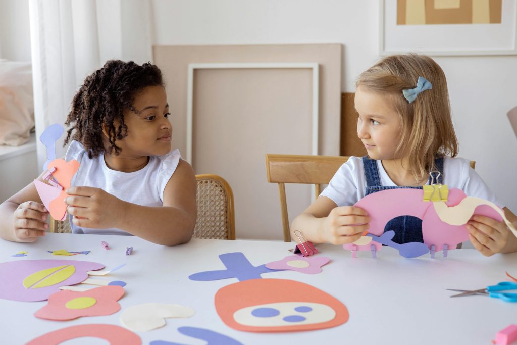 Children creating artwork at Little Big People Early Learning Artwork creation during the Outside School Hours Care Program at Little Big People Early Learning.