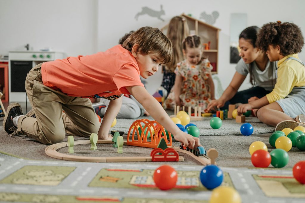 Children playing with cars pre-kindergarten at Little Big People Early Learning