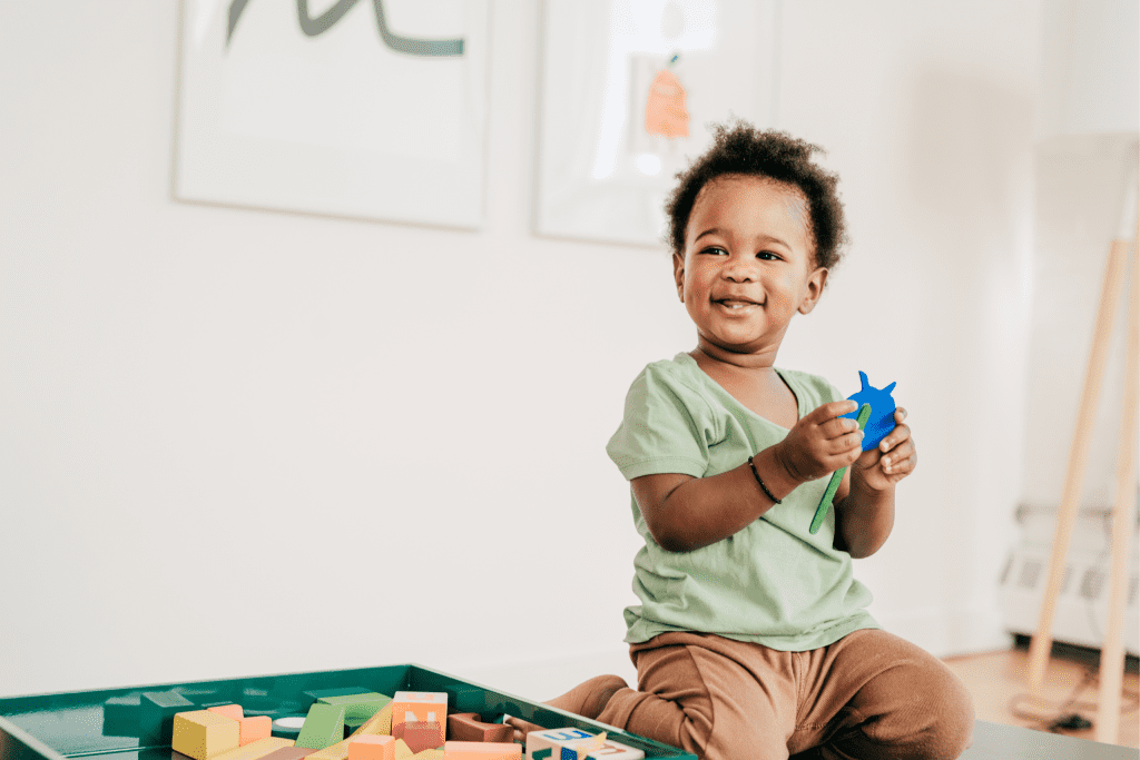 Cute baby playing with colourful toys Cute baby playing with colourful toys