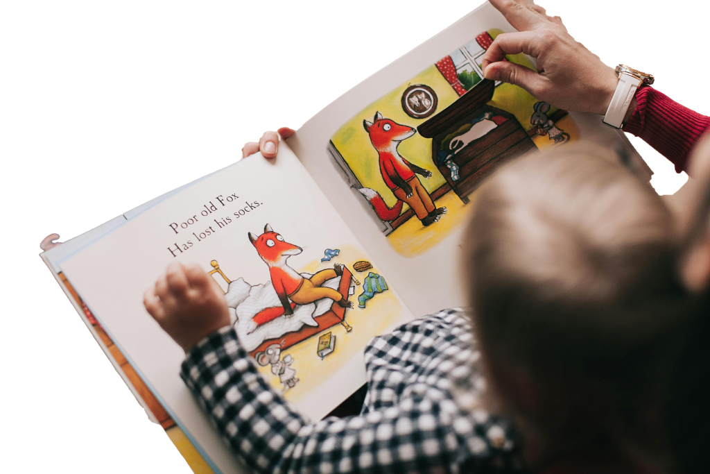An educator reading a book to a child at Little Big People Early Learning